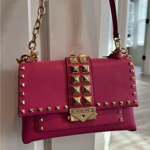 Pink leather studded shoulder bag